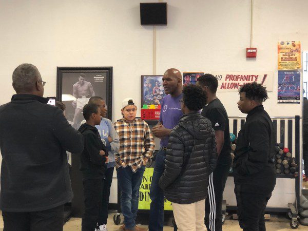 A group of people engaged in a discussion indoors.