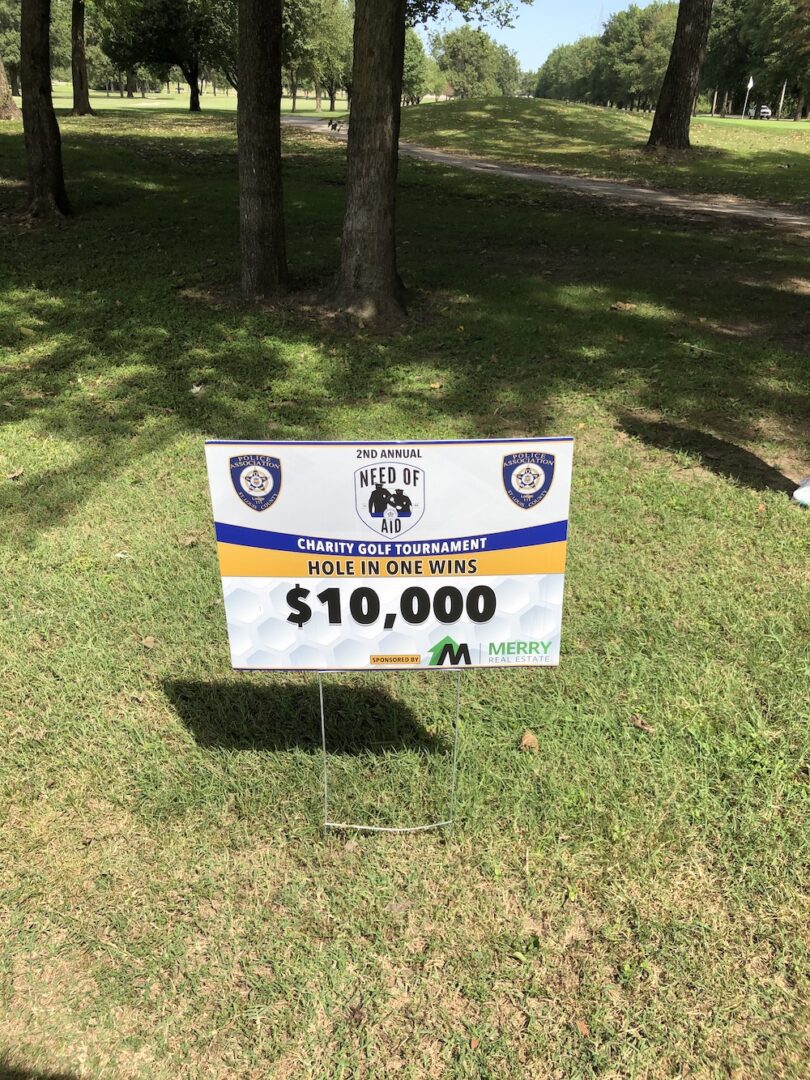 Sign displaying a $10,000 prize for a golf tournament.