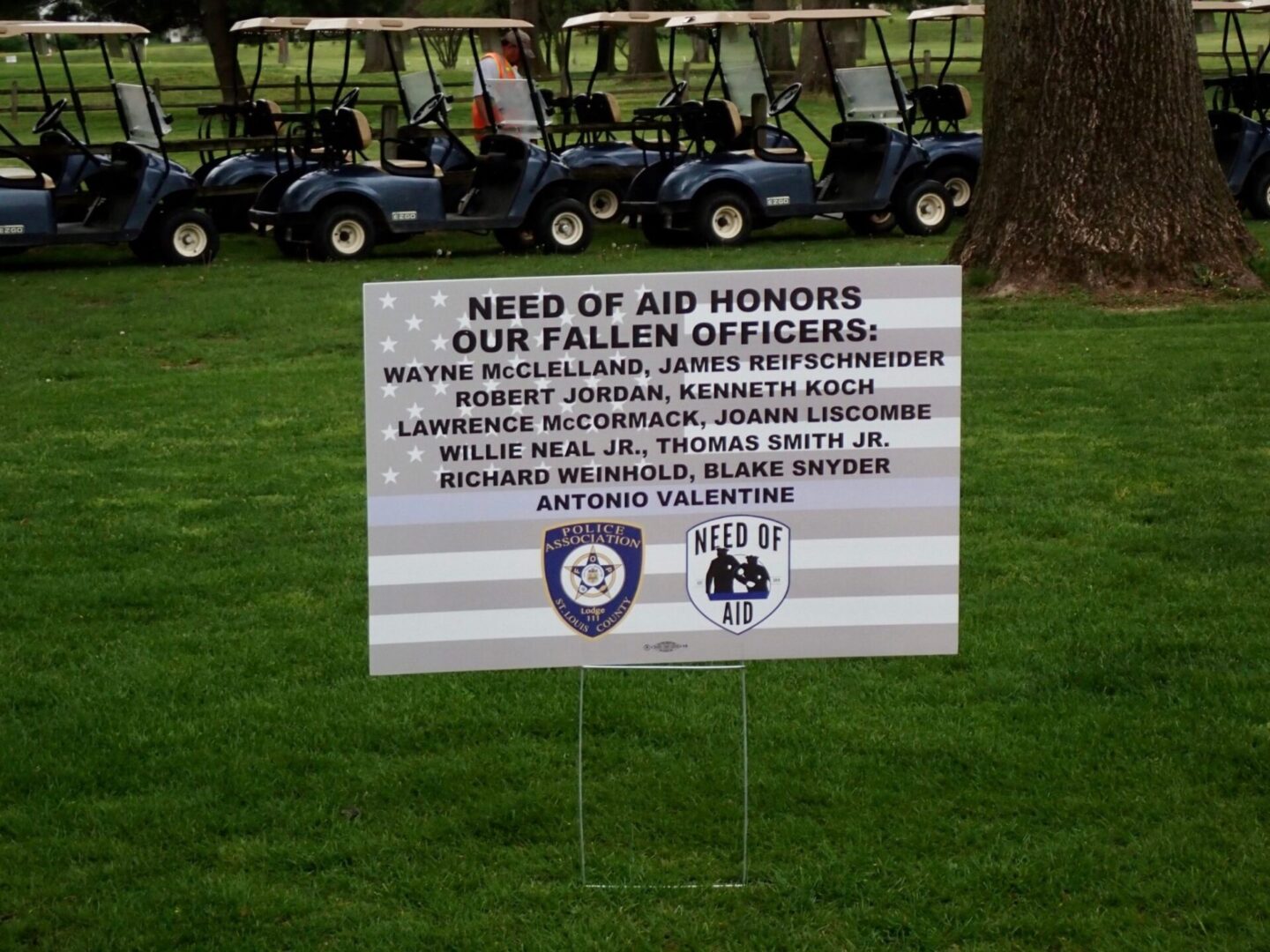 Memorial sign honoring fallen officers on golf course