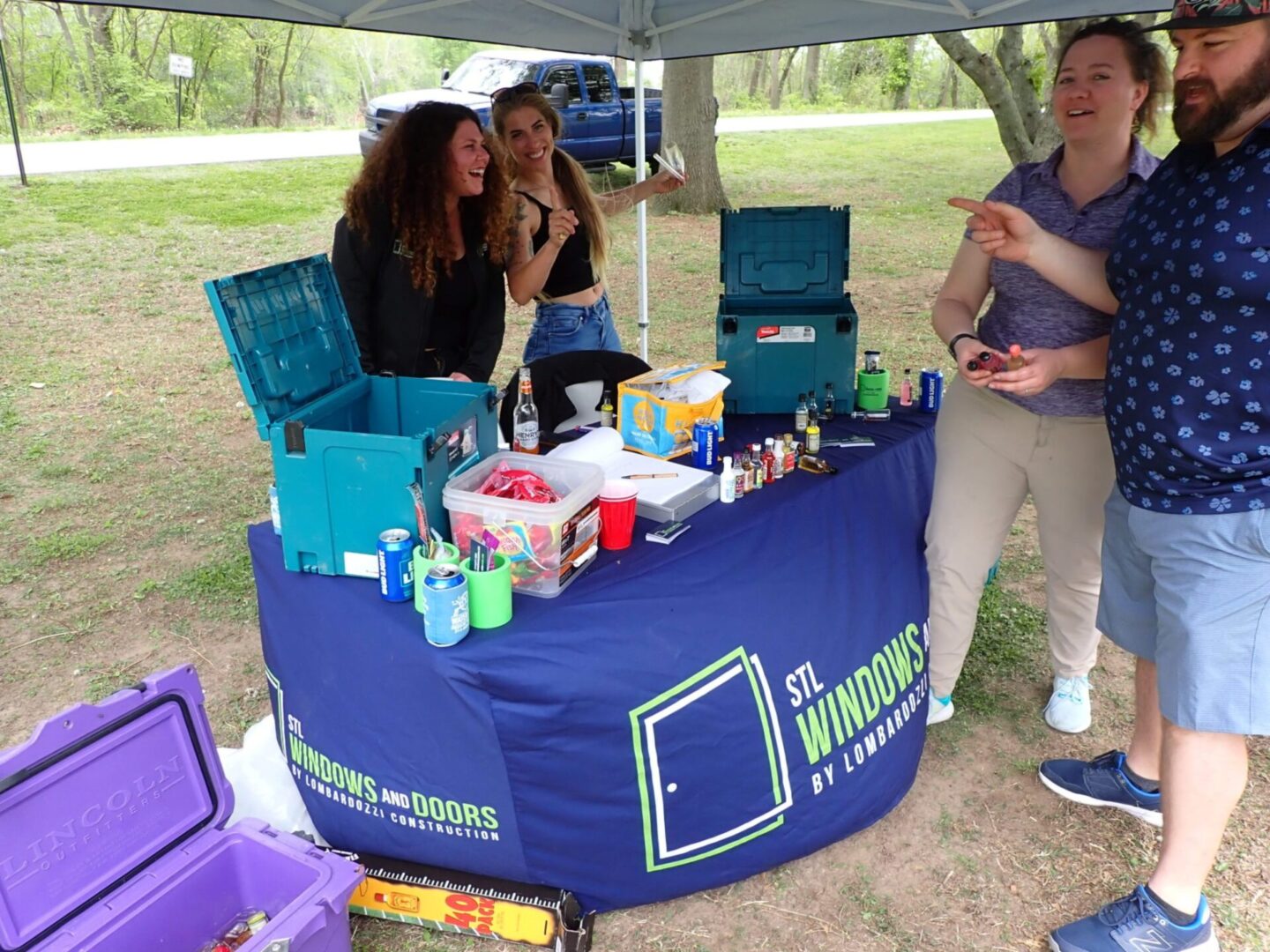 A vibrant community event booth promoting recycling and sustainability.