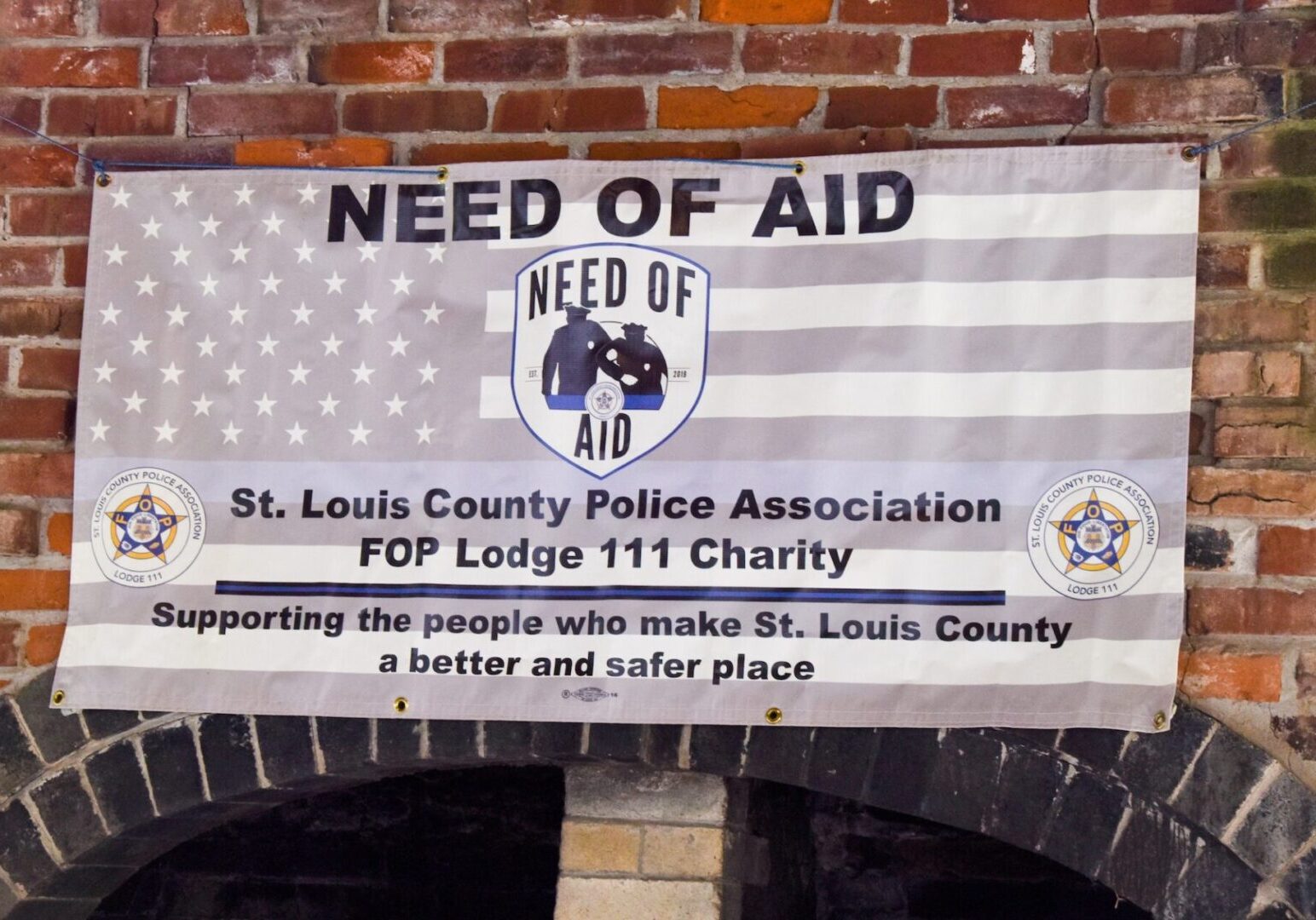 Banner seeking aid for St. Louis County Police Association charity.